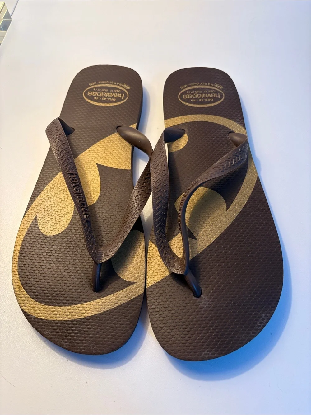 THREE pairs of men’s flip flops